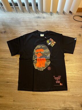 Black Short-Sleeve Bape Graphic Tee with Orange & Green Camo Ape Motif
